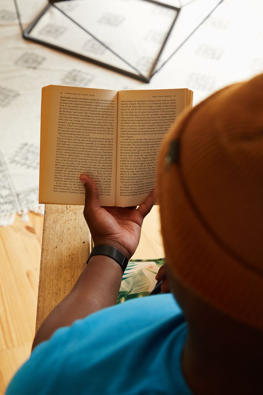 crop man with book at table